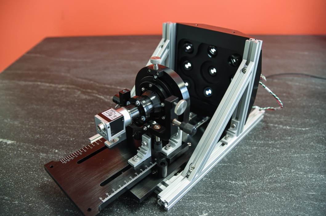 Figure 1 - Custom test and align station for an underwater camera. This fixture allows Optikos to compensate field tilt during camera integration, set focus, and test and  record full-field performance in one operation.  